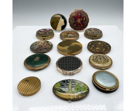 Mixed lot of gold, enameled and leather compacts. Round compacts sized from 2.75" to 3.5" dia. Standout compacts - 2 are deco