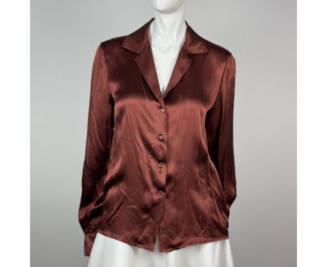 Stunning button up 100 percent silk blouse featuring a beautiful chocolate color and a deep V cut neck. Calvin Klein and Neim