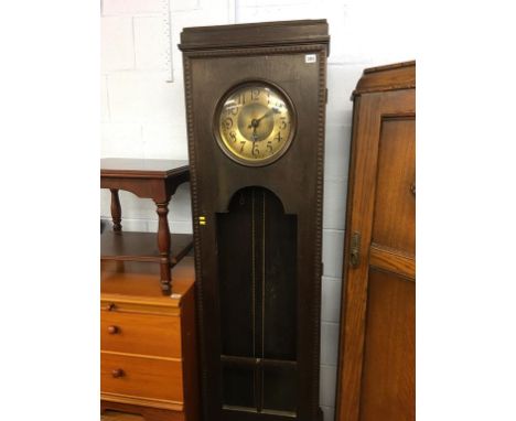 An oak cased clock