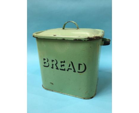 A green enamel bread bin