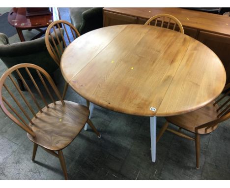 An Ercol drop flap table and four hoop back chairs