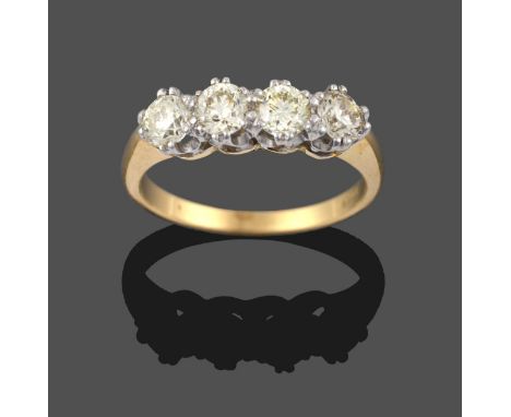 A Diamond Four Stone Ring, the round brilliant cut diamonds in white double claw settings, to a yellow tapered shoulder plain