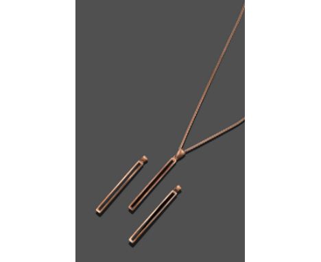 A 9 Carat Rose Gold Jet Pendant on a 9 Carat Rose Gold Chain, a slice of polished jet in a rose rubbed over setting, on a fan