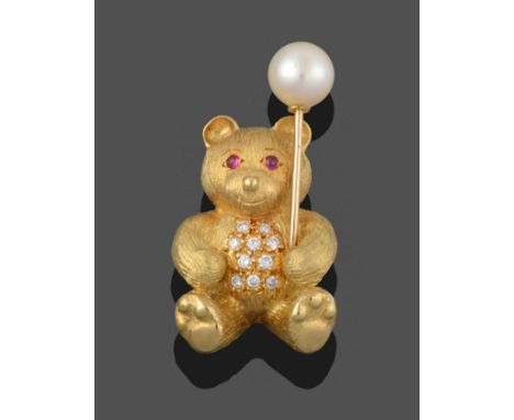 An 18 Carat Gold Diamond, Ruby and Cultured Pearl Teddy Bear Brooch, the yellow textured bear with cabochon ruby eyes, a roun