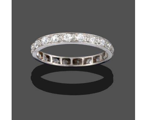 A Diamond Eternity Ring, the old cut diamonds in white claw settings, to a flat sided shank, total estimated diamond weight 1