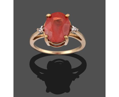 A 9 Carat Gold Orange Sapphire Ring, an oval cut orange sapphire, to round brilliant cut diamond set shoulders, in yellow cla