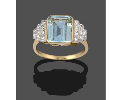 An Aquamarine and Diamond Ring, an emerald-cut aquamarine in a yellow millegrain setting, to stepped shoulders inset with rou