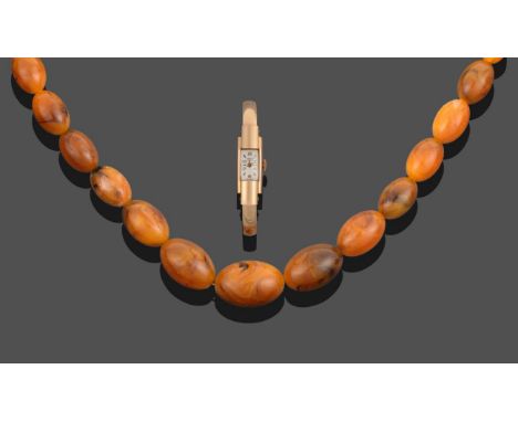 A Pressed Amber Necklace, forty-one graduated beads of pressed amber, length 76cm; and A Lady's 18 Carat Gold Wristwatch, sig