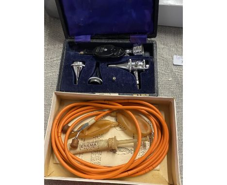 A boxed vintage ophtalmoscope and one other 