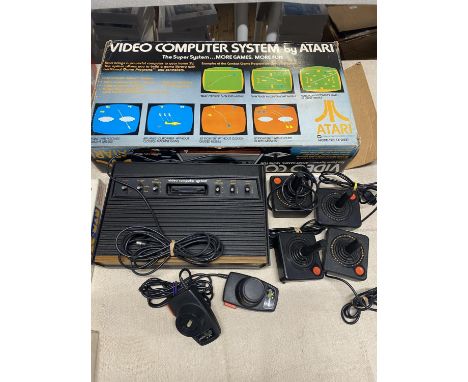A boxed Atari Computer console model number CX-2600. With controllers etc. 