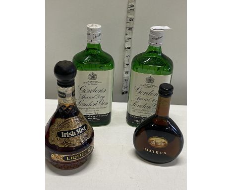Two new bottles of Gordons gin, a bottle of Irish Mist liqueur &amp; small bottle of Mateus Rose 