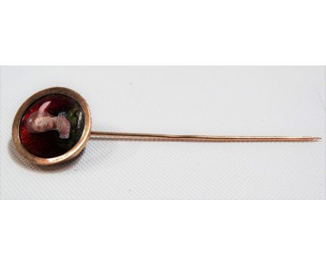 Rose gold &amp; coloured enamel stick pin, the circular finial decorated with a glass portrait of a lady, weight 3.4g approx.