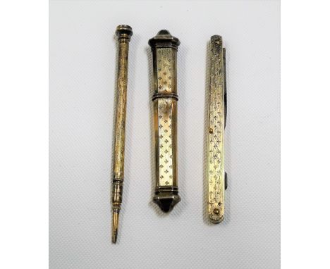 Three silver gilt engine turned implements &amp; an etui