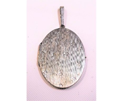 Modern 15ct white gold oval locket, with engine turned front, the suspension loop stamped 585, weight 11.8g approx.