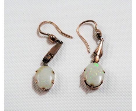 Pair of gold mounted oval white opal drop earrings with green, purple &amp; orange flashes, the opals of 1.5ct spread each ap