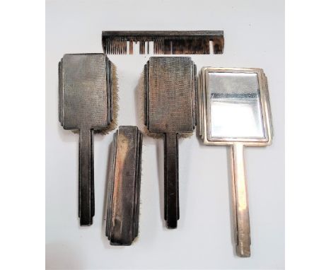 George V silver engine turned Art Deco five piece dressing table set, comprising two hairbrushes, a clothes brush, comb and h