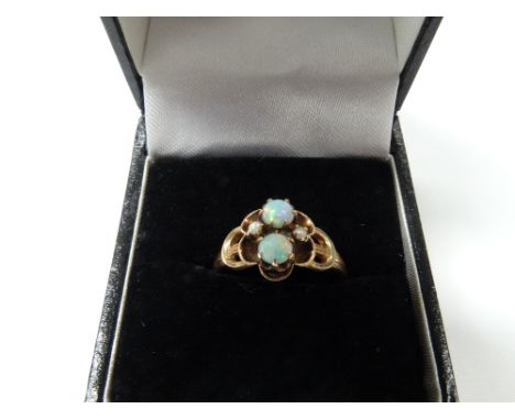 14ct gold opal &amp; seed pearl set four stone ring, the opals of 0.20ct spread approx &amp; showing colours of red, orange, 