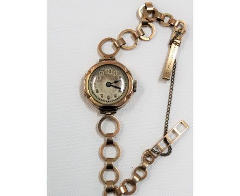 Early 20th Century 9ct rose gold ladies manual wind wristwatch with 9ct gold bracelet, the silvered dial with Arabic Numerals