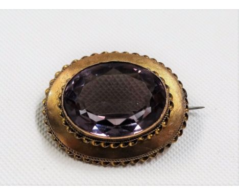 12ct gold amethyst set oval brooch, width 30mm