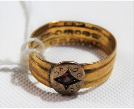22ct gold band ring, made up of three bands and applied with a 9ct gold ruby set face, weight overall 3g approx.