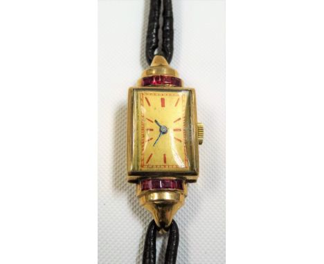 1940's 9ct ruby set cased ladies manual-wind cocktail watch with leather gold mounted strap, the 12mm rectangular gilded dial
