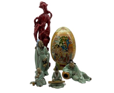 Japanese Satsuma Egg decorated with domestic scenes and gilt on feet, four Chinese ceramic 'Mud Men' figures, red resin statu