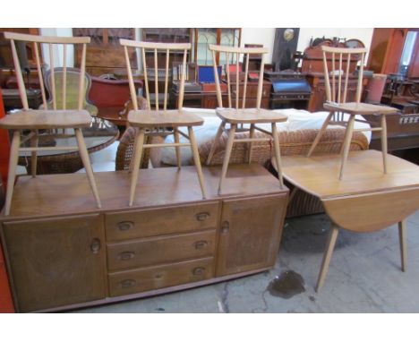 An Ercol teak sideboard together with table and for chairs, the chairs stamped Reg Design No.884923