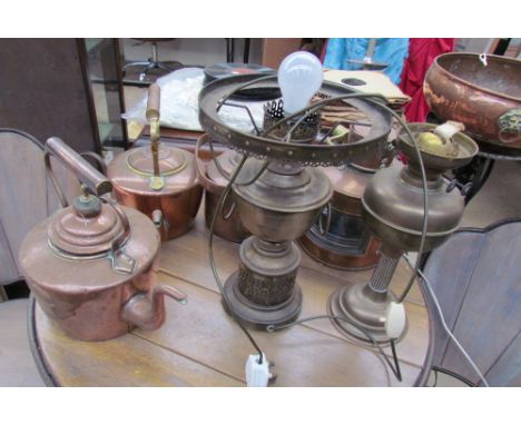 A copper lamp together with copper kettles, oil lamps, jardiniere stand etc