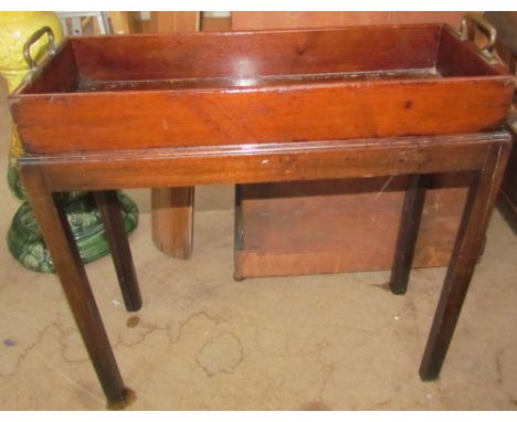 A George III mahogany plant trough and stand of rectangular form, with brass handles, the stand with reeded edge and square c