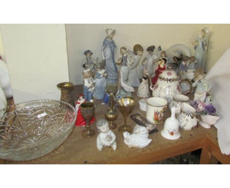 A collection of Lladro figures including ladies, children etc together with Nao and Royal Doulton figures, plates etc