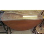A 19th century mahogany gate leg dining table with drop flaps on cabriole legs and pointed pad