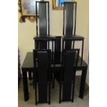 A black glass extending dining table and six chairs