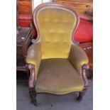 A Victorian mahogany framed spoon back library chair on turned legs and casters