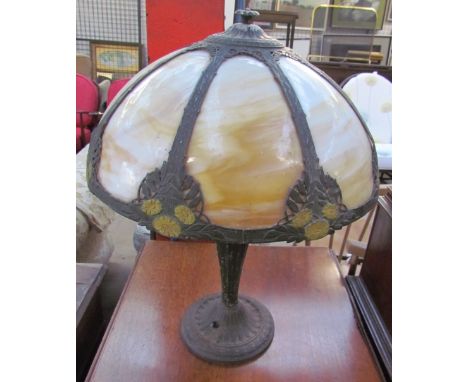 A Tiffany style table lamp with smoked glass panels, moulded with flowers and leaves