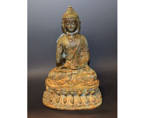 A bronze coloured metal figure of Buddha, 27cm high