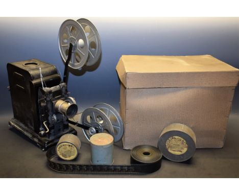 An early 20th century German cine camera, R & LF, Ximaipa, with some film reels, original box