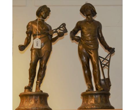 A pair of 19th century French patinated spelter figures, each holding the tools of their trade, 49cm high