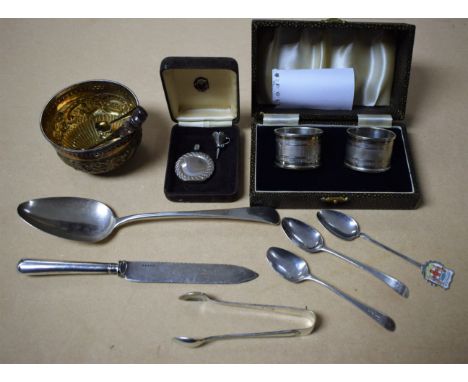 A silver sugar bowl, London 1898; a pair of silver napkin rings, cased; a George III silver serving spoon, London 1804; simil