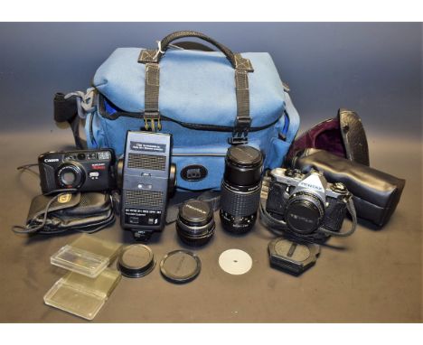 A Pentax ME Super SLR camera, with 1:1.7, 50mm lens; a Pentax zoom lens, 1:4, 75-150mm; a Canon sureshot camera; etc.