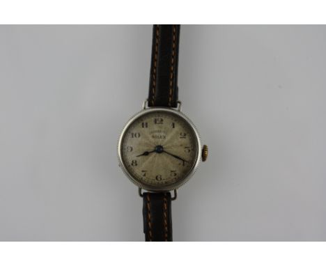 A vintage Rolex ladies wristwatch, with a circular silver case, the engine turned dial set out with Arabic numerals, on a fin