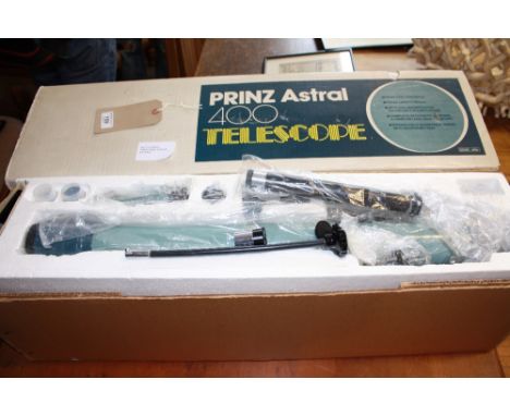 A boxed Prinz Astral model 400 telescope.
