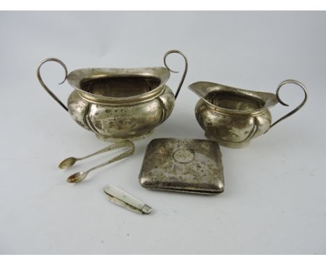 A silver milk jug and sucrier, Birmingham 1908, of oval gourd shape, together with a cigarette case, pair of sugar nips, and 