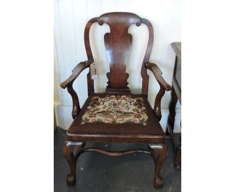 A George I design walnut elbow chair with solid vase splat back over a polychrome tapestry drop in seat on cabriole legs with