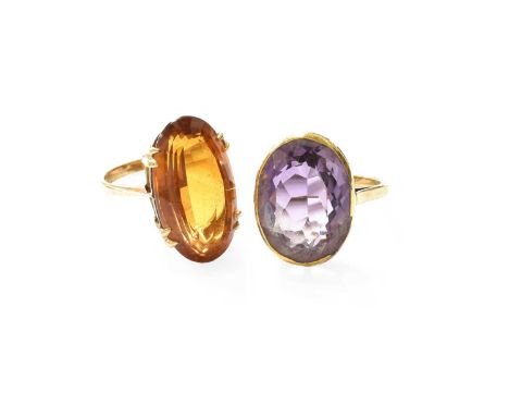 An Amethyst Ring, the oval cut amethyst, in a yellow rubbed over setting, to a tapered shoulder plain polished shank, finger 