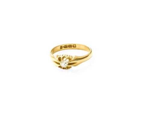An 18 Carat Gold Diamond Solitaire Ring, the old cut diamond in a yellow claw setting, to a plain polished shank, finger size