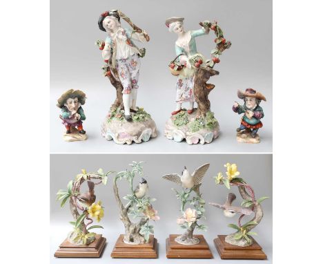 Four Royal Worcester Bisque Bird Models, a pair of 19th century Continental porcelain figures of a boy and girl picking fruit