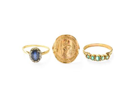 An 18 Carat Gold Sapphire and Diamond Cluster Ring, the oval cut sapphire within a border of eight-cut diamonds, in white cla