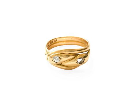 An 18 Carat Gold Diamond Snake Ring, the double headed serpent set with an old cut diamond, in yellow claw settings, to a dou