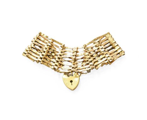 A 9 Carat Gold Gate Link Bracelet, with a 9 carat gold heart shaped padlock clasp, length 18cmEvidence of lead solder repair.