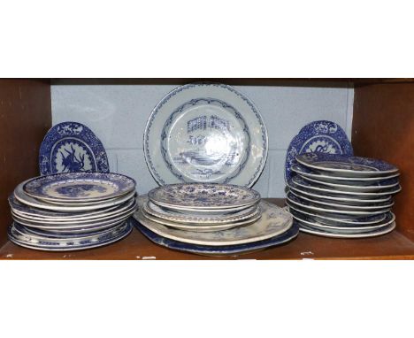 An English Delft Charger, circa 1750, painted with a chinese elnadscape with a single figure under the shade of a willow tree